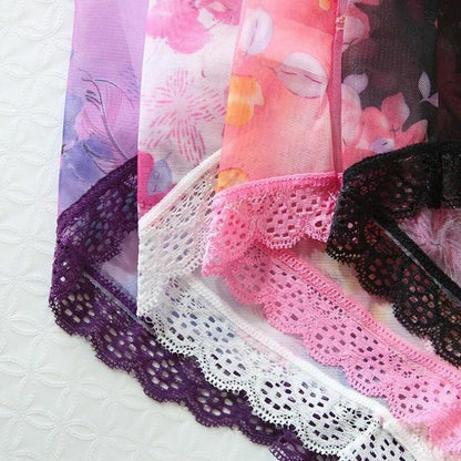 Close-up of colorful fabric with lace trim on a white background