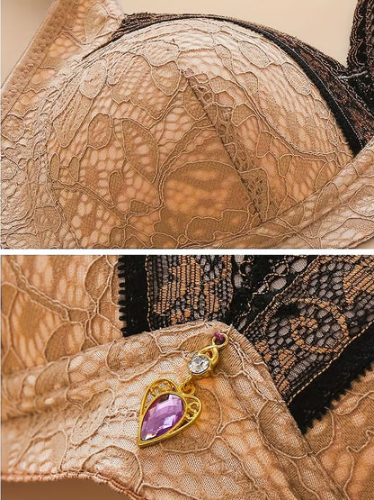 Close-up of lace fabric with a decorative charm featuring a purple gemstone.