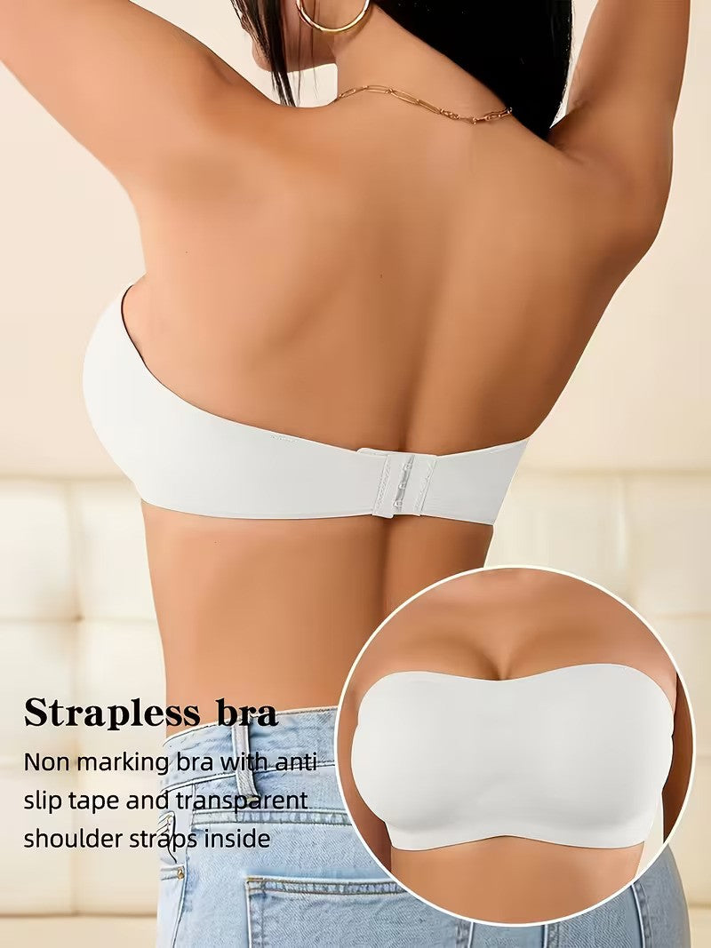 Strapless bra with anti-slip tape and transparent shoulder straps, worn by a person.