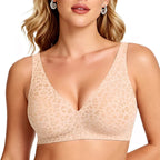A close-up of a woman wearing a beige leopard-print bralette against a plain white background.