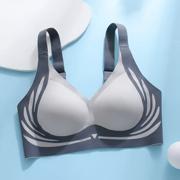Gray bra with black straps on a light blue background